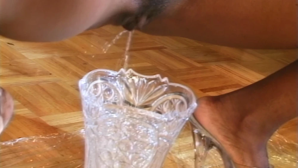 Ebony Slut Squirts Pussy Juice into Crystal Vase: Watch on SadoOnly